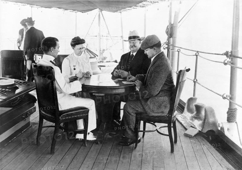 William Howard Taft Playing Cards with his Wife Helen Herron Taft and Two Men on boat enroute to Philippines where Taft was to head up the 2nd Philippine Commission (aka Taft Commission), April 1900