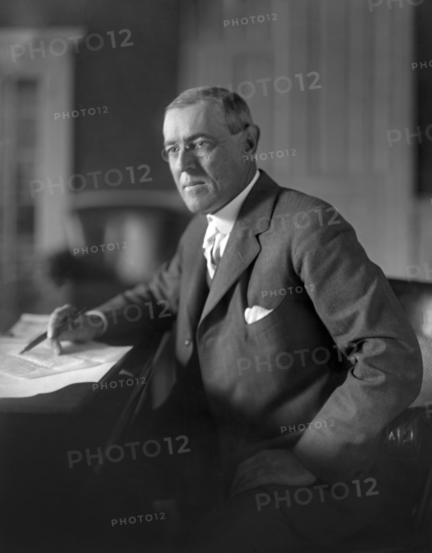 Woodrow Wilson (1856-1924) 28th President of the United States 1913-1921, Three-Quarter Length Portrait seated at desk in White House Oval Office, Washington, D.C., USA, Photograph by  Harris & Ewing, 1913-1917