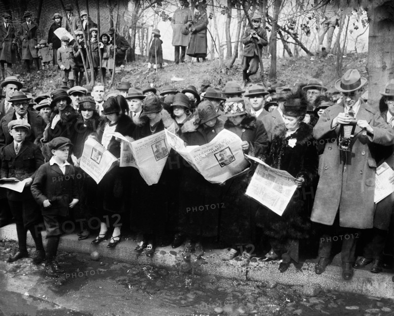 Group reading newspapers with News of Death of Former U.S. President Woodrow Wilson, Washington, D.C., USA, Harris & Ewing, February 1924
