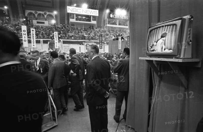 Delegates with State Signs and a Television Screen, Democratic National Convention, Boardwalk Hall, Atlantic City, New Jersey, USA, photograph by Thomas J. O'Halloran, August 1964