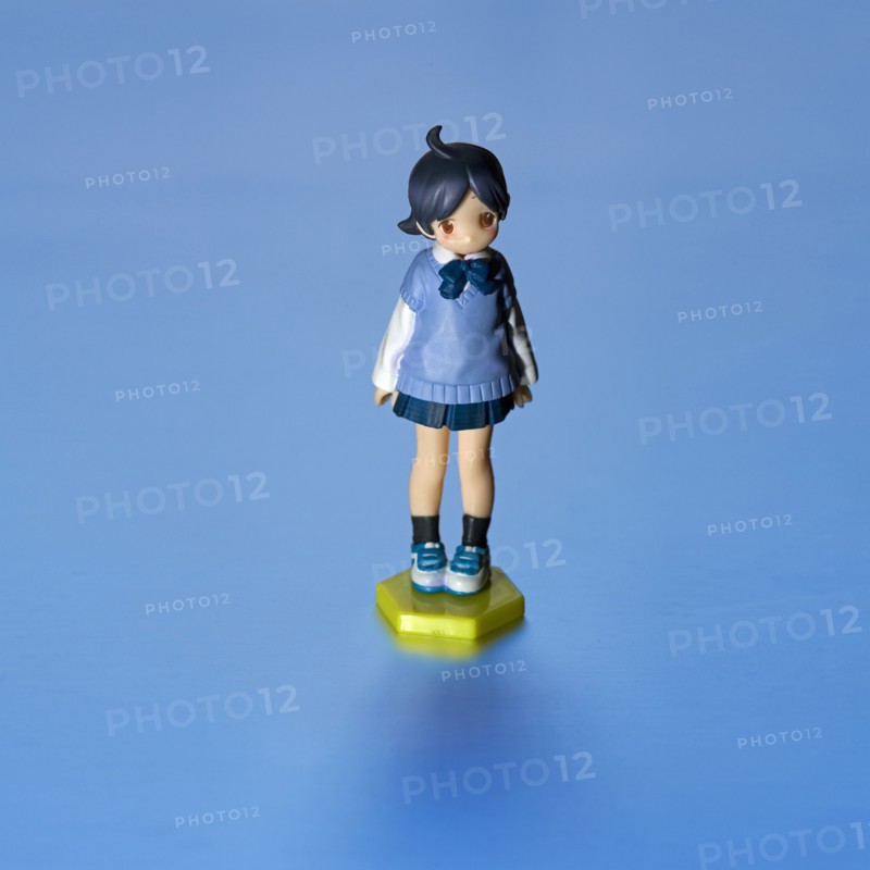 Young Girl Figurine, Blue against Blue Background
