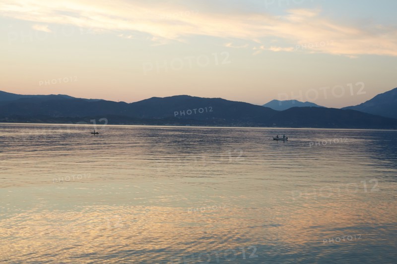 Fishermen at Dusk with Mountainous Landscape in Background, Patras, Greece