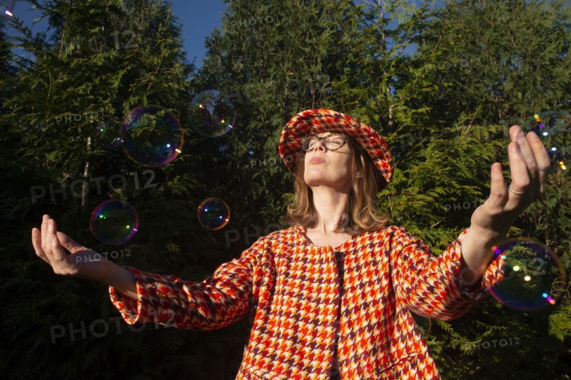 Mid-Adult Woman in Vintage Outfit with Bubbles