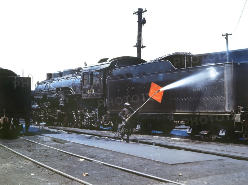 Worker Cleaning an engine near the Roundhouse