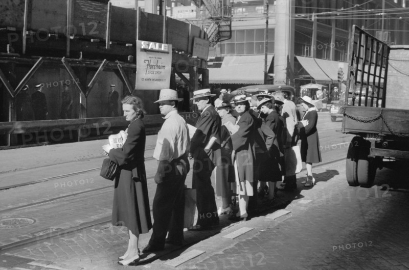 Group of People waiting for Street Car