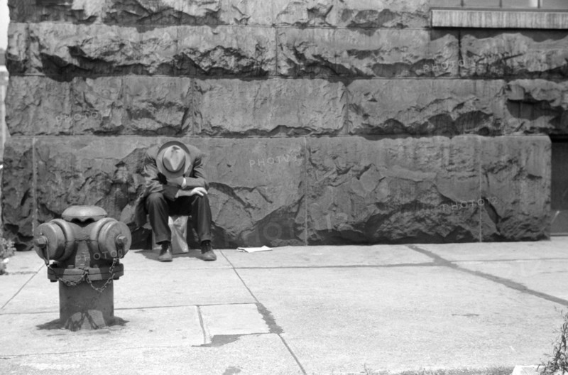 Man seated on Corner of Jefferson Street and Vernon Park Place