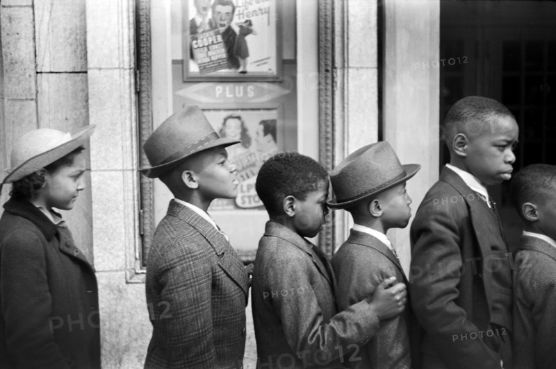 Half-Length Profiles of Children in front of Moving Picture Theater