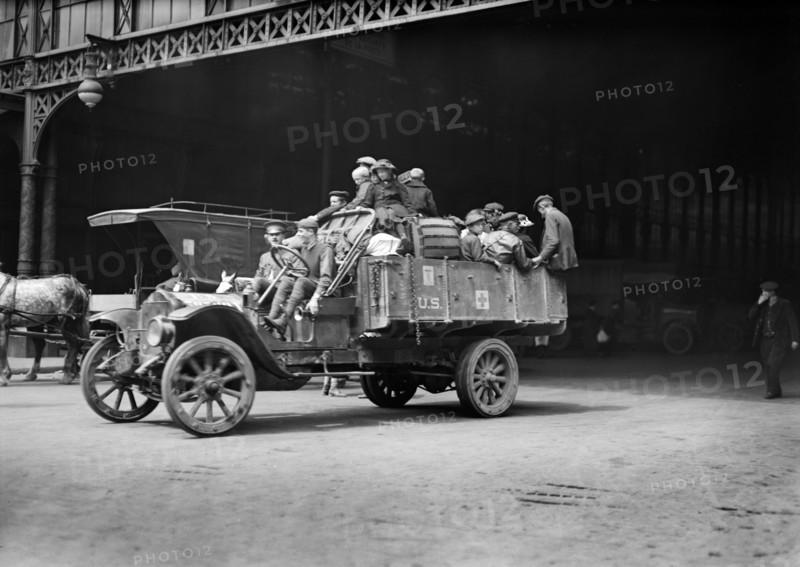 American Red Cross Workers taking a Camion load of Refugees with their Baggage from the Gare de l'Est to another Station