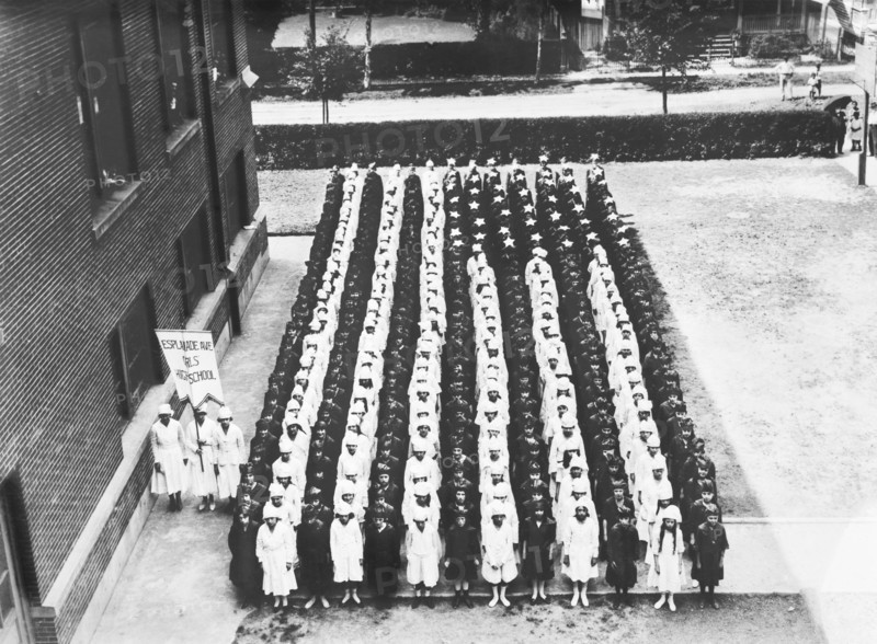 Junior Red Cross Auxiliary forming American Flag