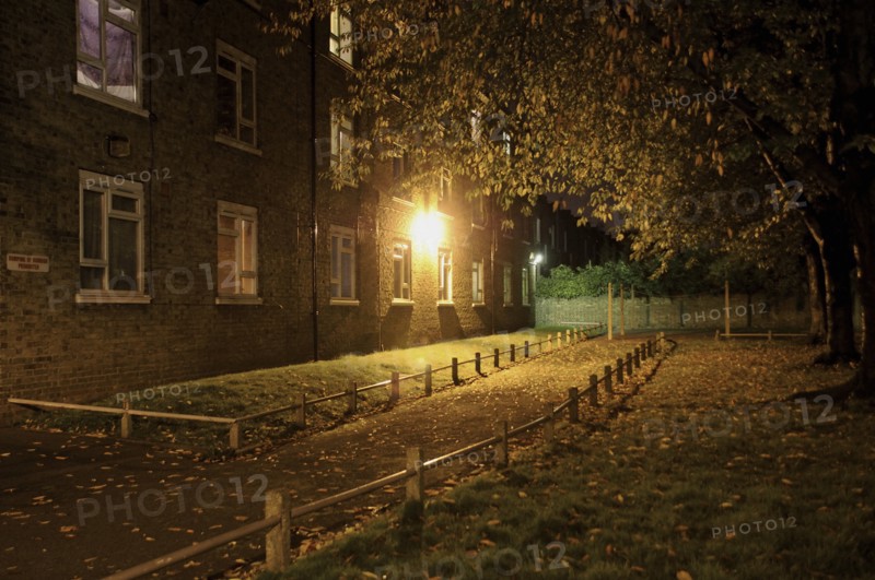 Illuminated Path by Apartment Building
