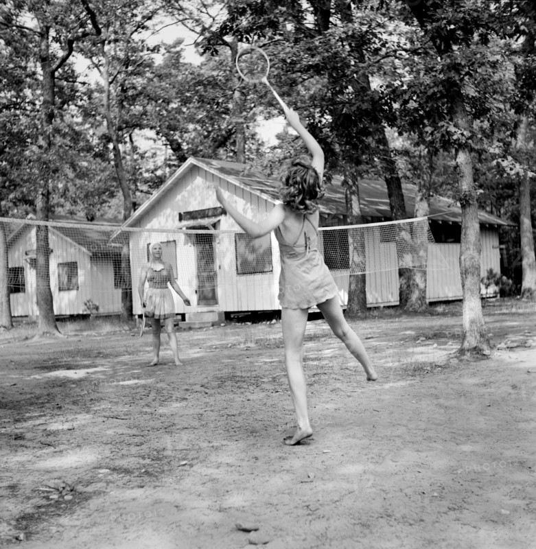 Two Girls playing Badminton