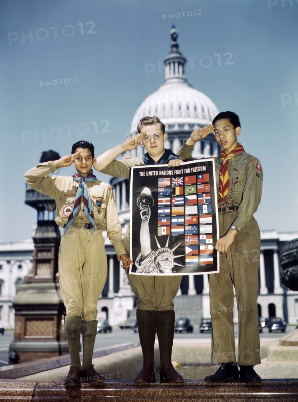 Portrait of Three Saluting Boy Scouts helping to Distribute The United Nations Fight for Freedom Posters to help War Effort