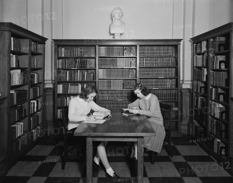 Two Students studying in Library, Trinity College (Trinity Washington University), 1952