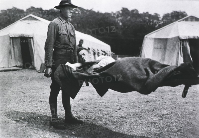 Patient being transported on Stretcher, Two Tents in background, 1914-1918
