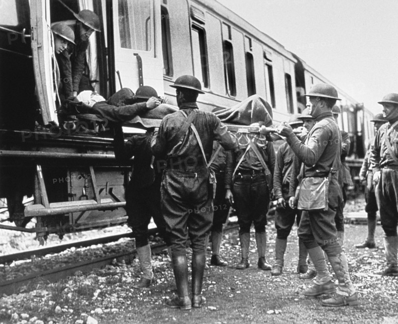 Group of Soldiers carrying Wounded Men aboard  Hospital Train, Herouville, 1918