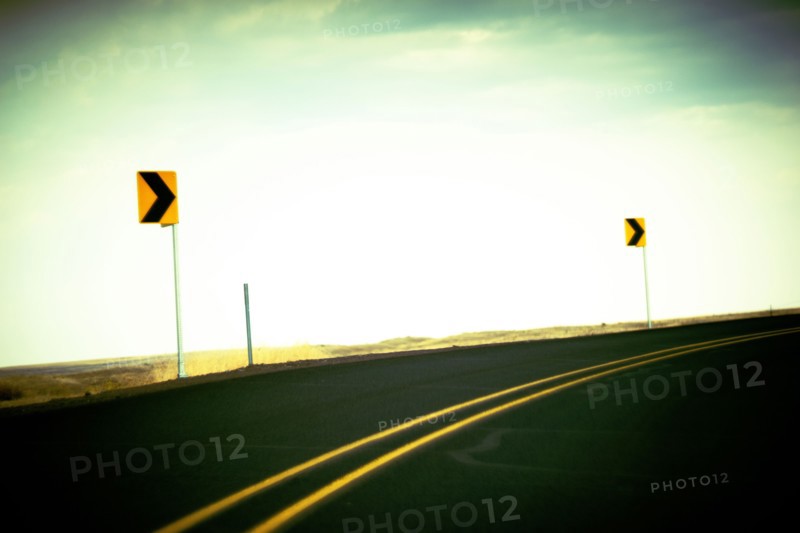 Directional Signs along curving Roadside ,,