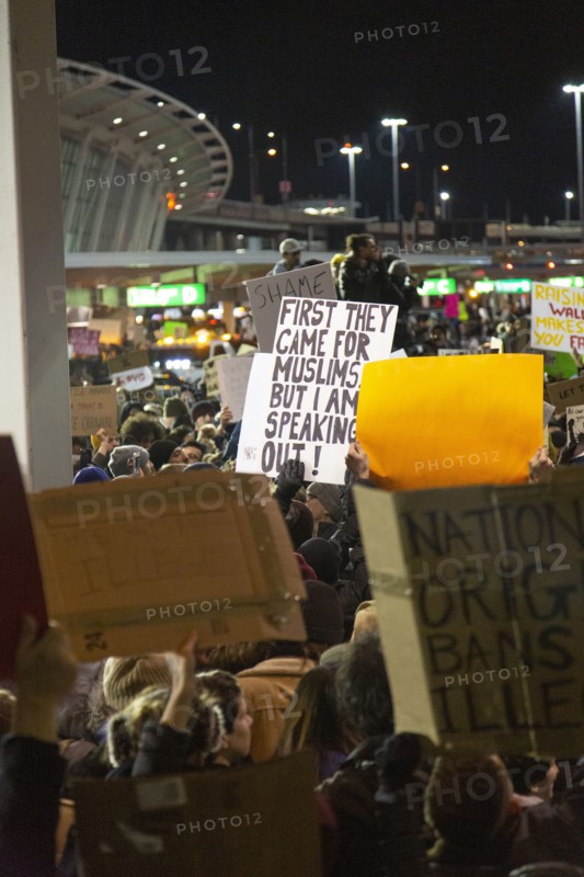 Crowd holding Signs at Protest against Muslim Travel Ban, JFK Airport,