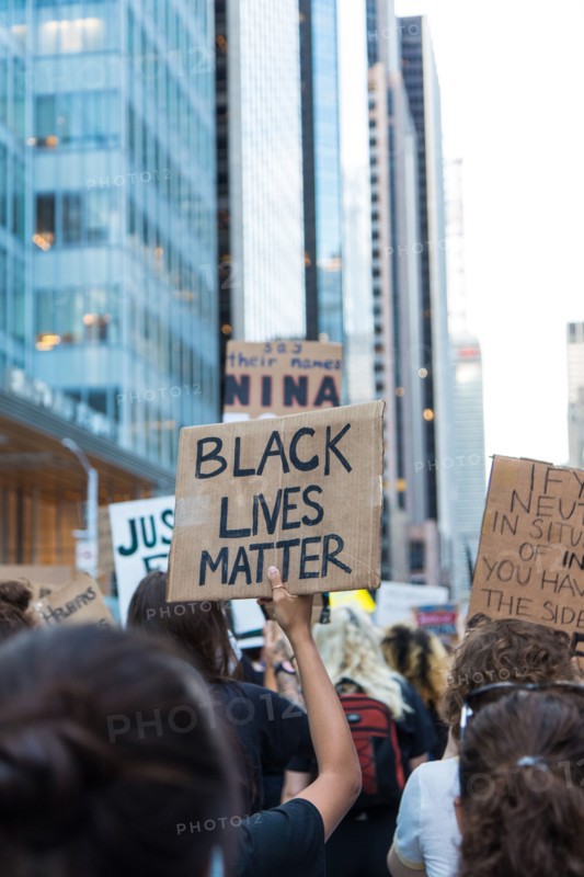 Protester holding up Black Lives Matter Sign during Juneteenth March, Midtown,