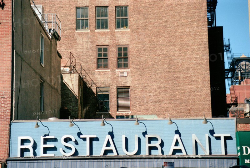 Blue & White Restaurant Sign on Building,,