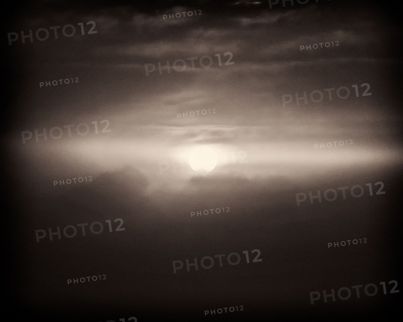 Sun viewed through Cloudy Sky,,