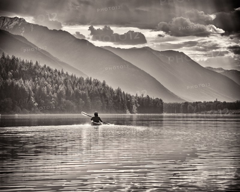 Rear View of Woman Kayaking,,