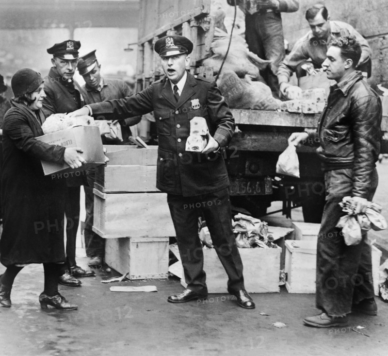 Police distributing Eggs and Bread to City's Needy at East 104th St. Station House, New York City