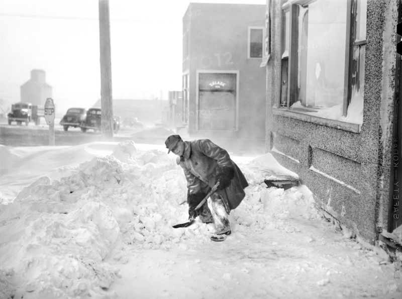 Man Shoveling Snow on Sidewalk, Draper