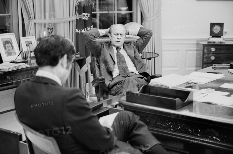 U.S. President Gerald Ford talking with aide John Mashek, at the White House