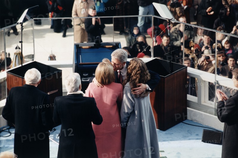 U.S. President Bill Clinton embracing his daughter