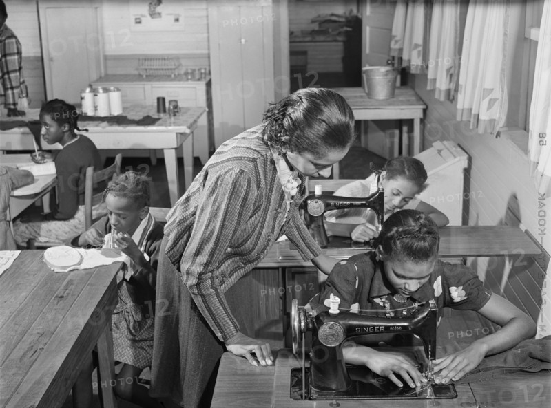 Students learning to Sew on Sewing Machines