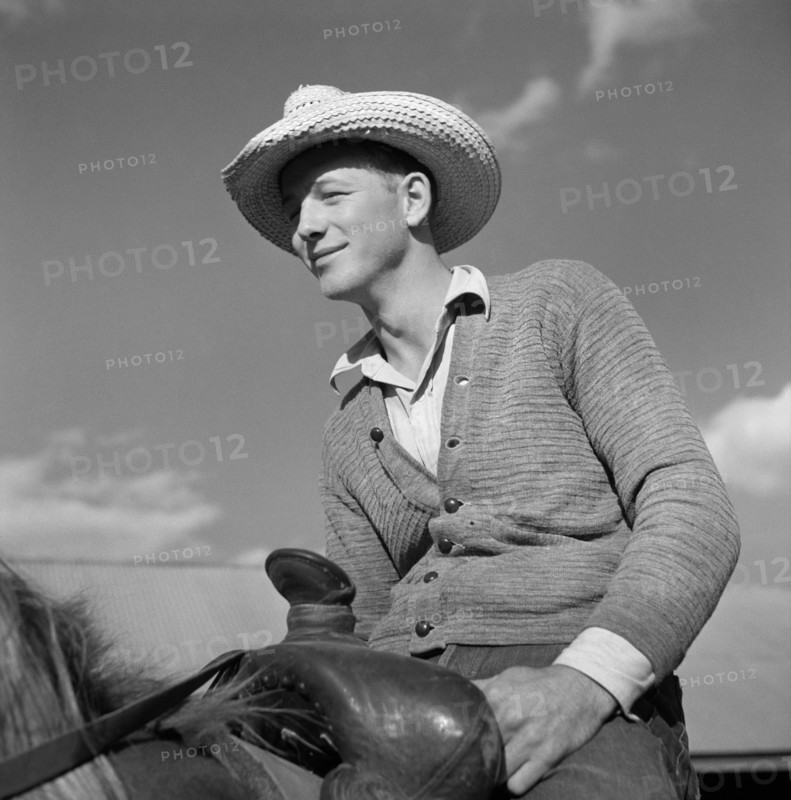 Cowboy on Ranch Horse in Corral at Quarter Circle U