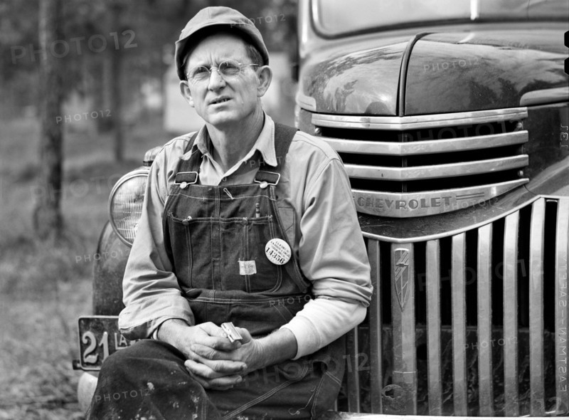 Construction Worker sitting on Car before leaving for Evening Shift