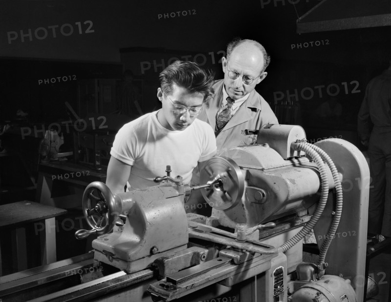 Chinese-American Student learning to operate Lathe to help in War Program