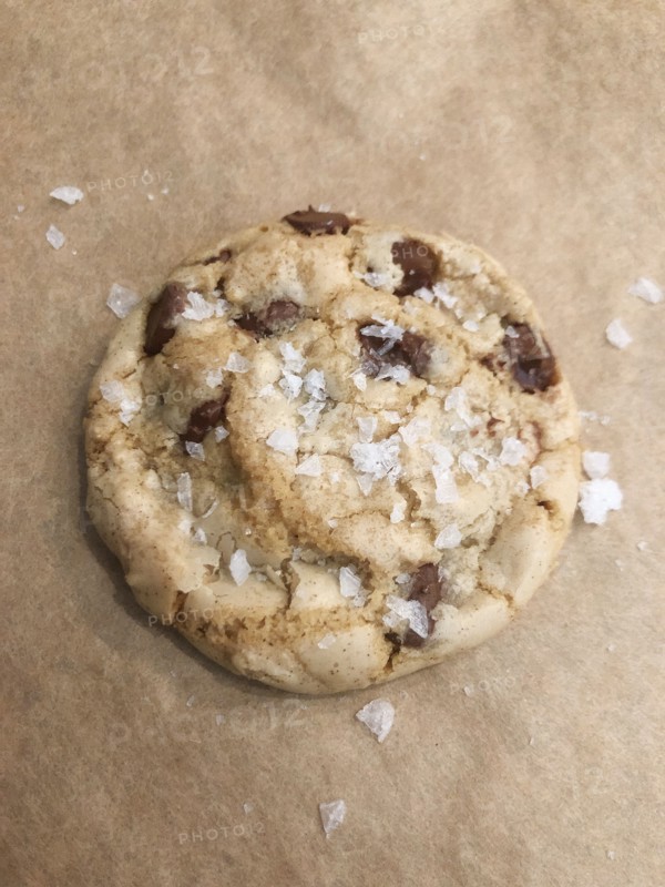 Sea Salt Chocolate Chip Cookies on Parchment Paper