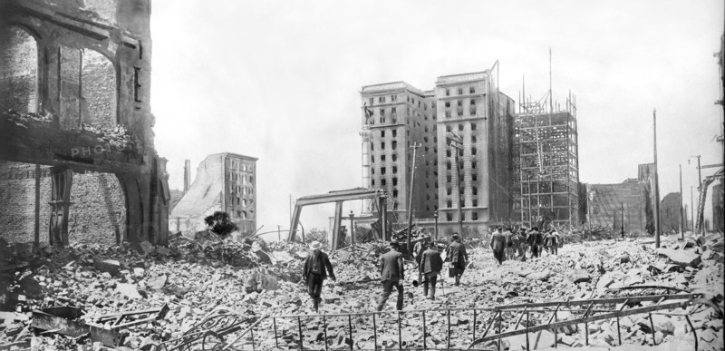 People walking through Rubble 2 days after Earthquake
