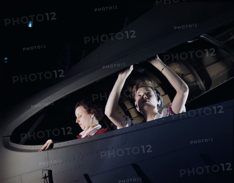 Two Women working on Bomber