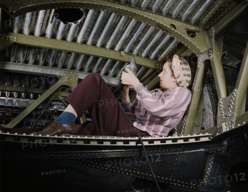 Woman riveting A-20 Bomber