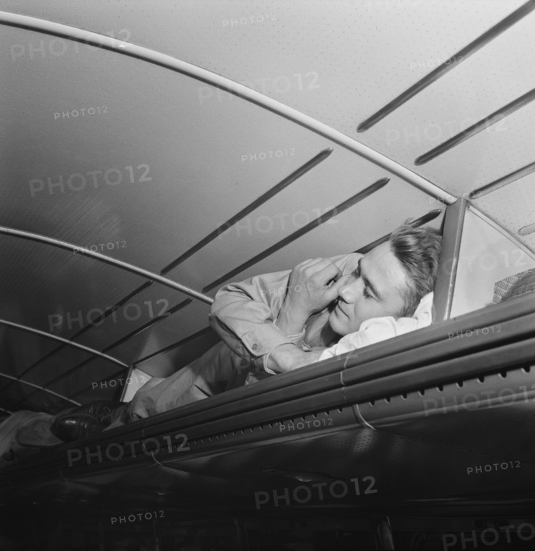 Soldier sleeping in Baggage Rack on Greyhound Bus going from Cincinnati