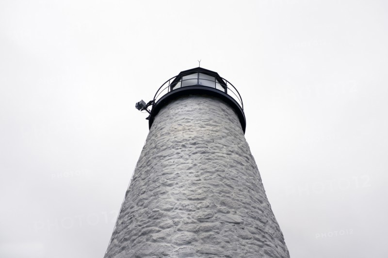 Low Angle View of Lighthouse against Foggy Sky