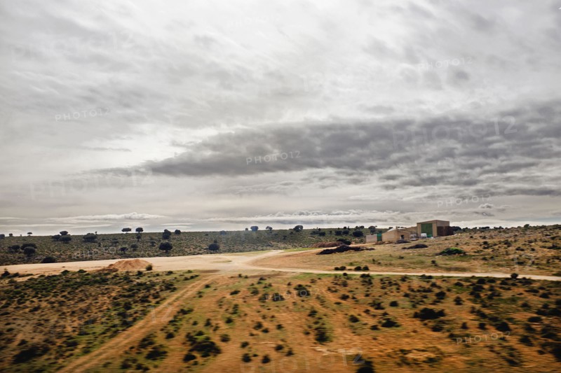Arid Landscape View through Train Window