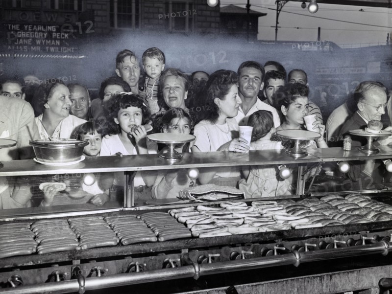 Group of People lined up at Counter