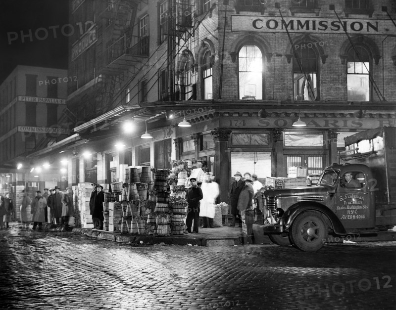 Trucks being loaded with Produce at Night