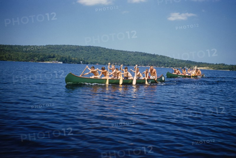 Camp Boys rowing Canoes