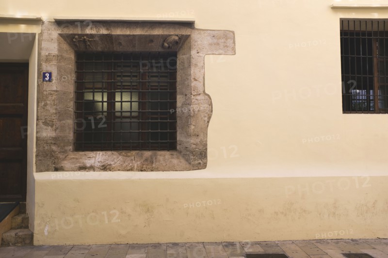 Building Exterior with Iron Bars on Window