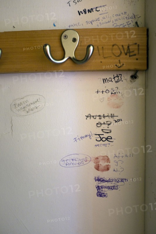 Clothes Hook and Graffiti inside Teenager's Closet