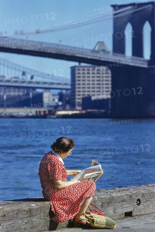 Woman reading Newspaper