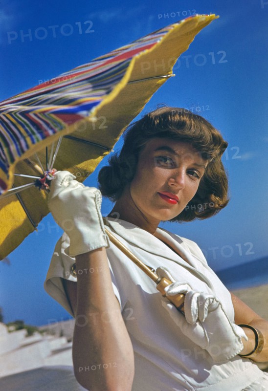 Young Woman in White Dress with Sun Umbrella