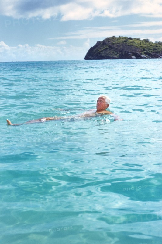 Man floating on Back in Water