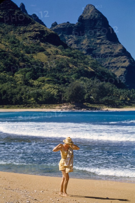 Solitary Woman walking along Beach