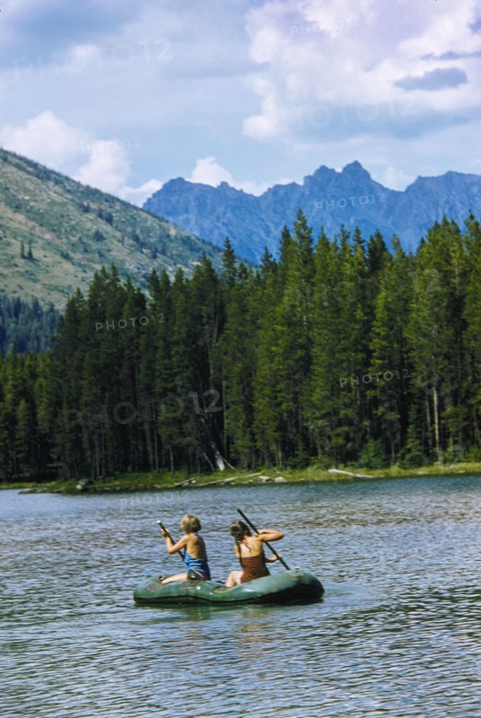 Two Girls rowing Rubber Boat